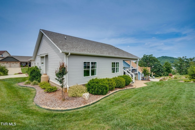 3137 London Rd, Kingsport, TN 37664 - back of property with a yard and roof with shingles