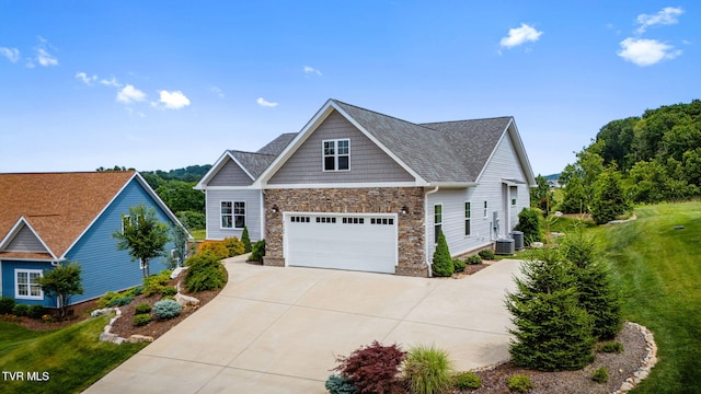 3137 London Rd, Kingsport, TN 37664 - craftsman inspired home featuring concrete driveway, stone siding, a garage, a front yard, and roof with shingles