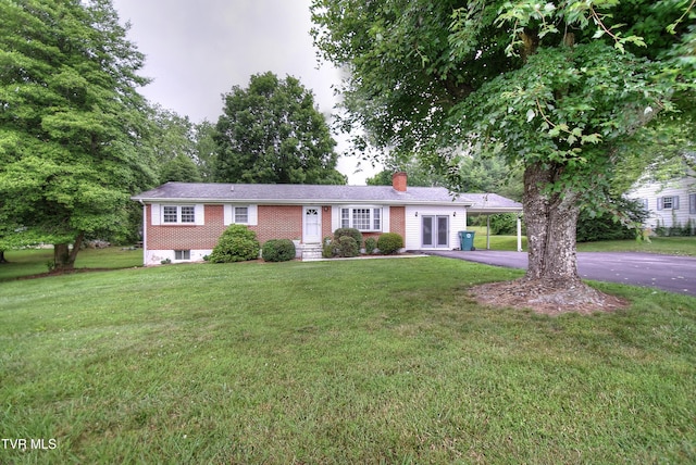 512 Old Airport Rd, Bristol, VA 24201 - single story home with a chimney, driveway, a carport, and a front lawn