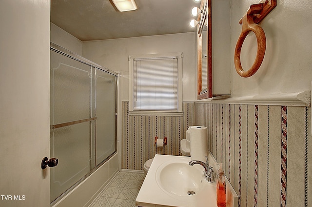 512 Old Airport Rd, Bristol, VA 24201 - bathroom featuring a wainscoted wall, shower / bath combination with glass door, and vanity