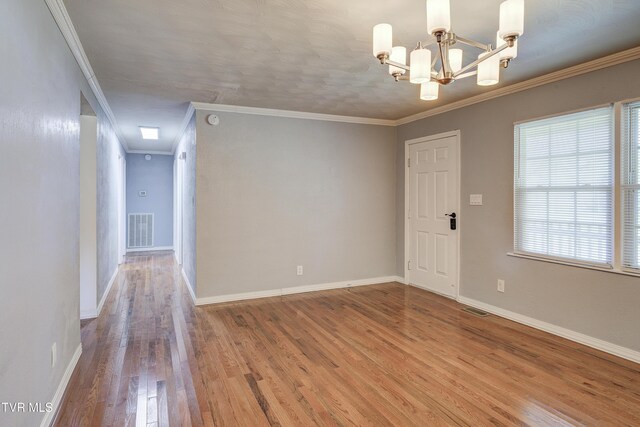 118 Hilbert Cir, Jonesborough, TN 37659 - unfurnished room featuring crown molding, wood finished floors, a chandelier, and a smoke detector