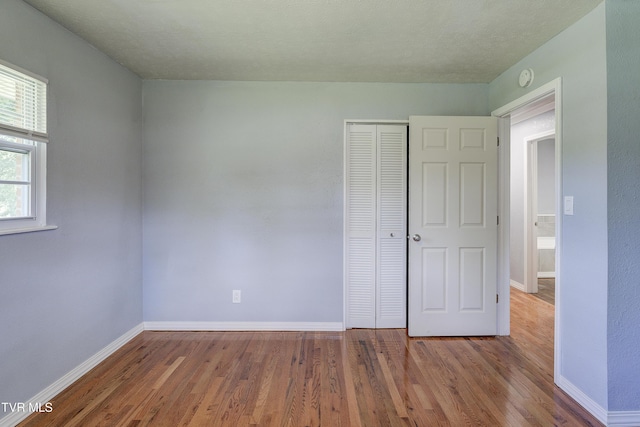 118 Hilbert Cir, Jonesborough, TN 37659 - unfurnished bedroom with wood finished floors and a closet