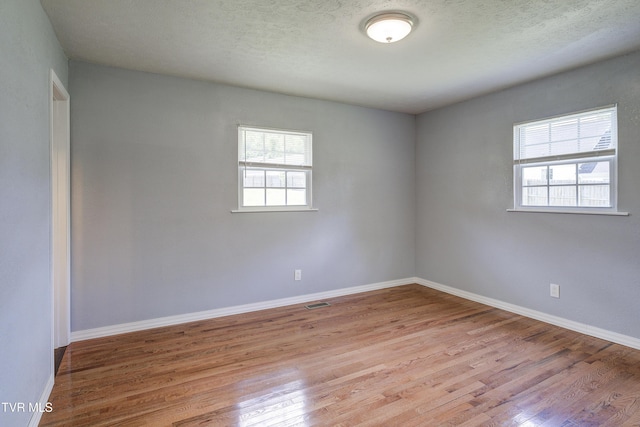 118 Hilbert Cir, Jonesborough, TN 37659 - unfurnished room featuring wood finished floors and a textured ceiling