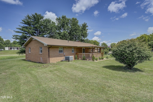 118 Hilbert Cir, Jonesborough, TN 37659 - rear view of property with brick siding, a yard, a deck, and a metal roof