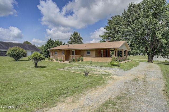118 Hilbert Cir, Jonesborough, TN 37659 - ranch-style house with a porch, a chimney, a front lawn, brick siding, and gravel driveway
