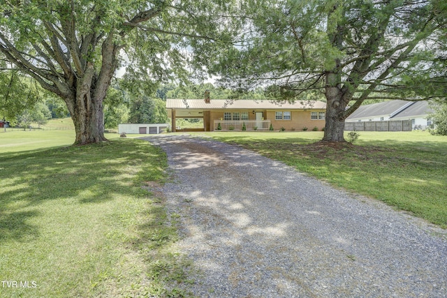 118 Hilbert Cir, Jonesborough, TN 37659 - single story home featuring gravel driveway, a chimney, and covered porch