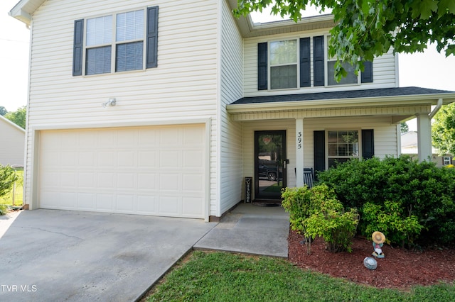 395 Kings Rd, Piney Flats, TN 37686 - view of front facade with a garage, covered porch, and driveway