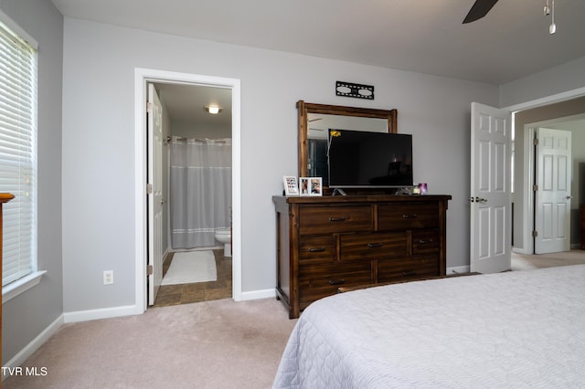 395 Kings Rd, Piney Flats, TN 37686 - bedroom with light carpet, connected bathroom, and a ceiling fan