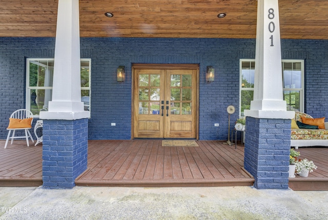 801 Watauga St, Kingsport, TN 37660 - property entrance featuring french doors, brick siding, and covered porch