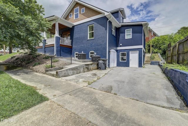 801 Watauga St, Kingsport, TN 37660 - view of front of property with brick siding, driveway, and a balcony