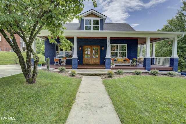 801 Watauga St, Kingsport, TN 37660 - view of front of property with french doors, a front yard, covered porch, and brick siding