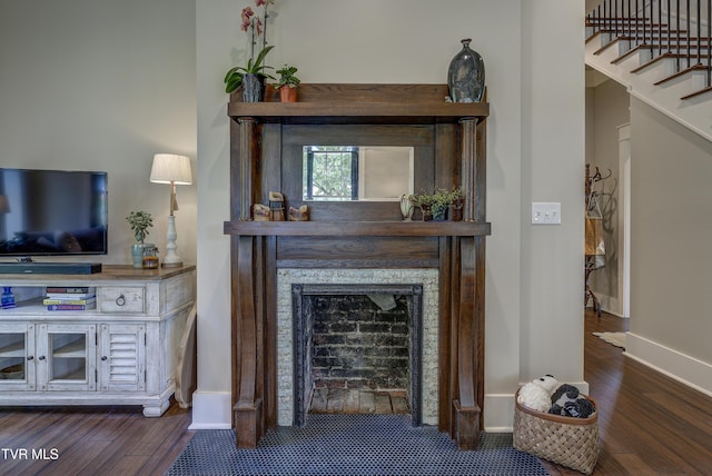 801 Watauga St, Kingsport, TN 37660 - living room featuring wood finished floors, stairway, and a fireplace