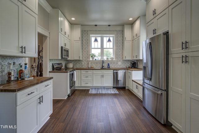 801 Watauga St, Kingsport, TN 37660 - kitchen with wooden counters, appliances with stainless steel finishes, dark wood-style flooring, backsplash, and recessed lighting