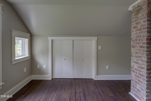 801 Watauga St, Kingsport, TN 37660 - unfurnished bedroom with lofted ceiling, dark wood finished floors, and a closet