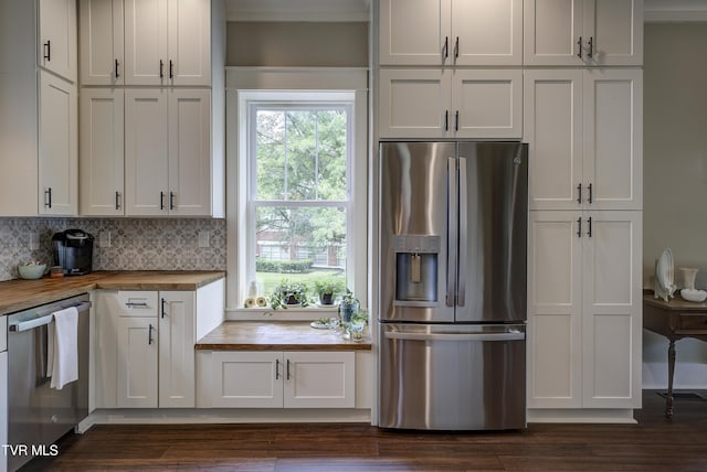 801 Watauga St, Kingsport, TN 37660 - kitchen with stainless steel appliances, butcher block countertops, dark wood-style floors, white cabinetry, and backsplash