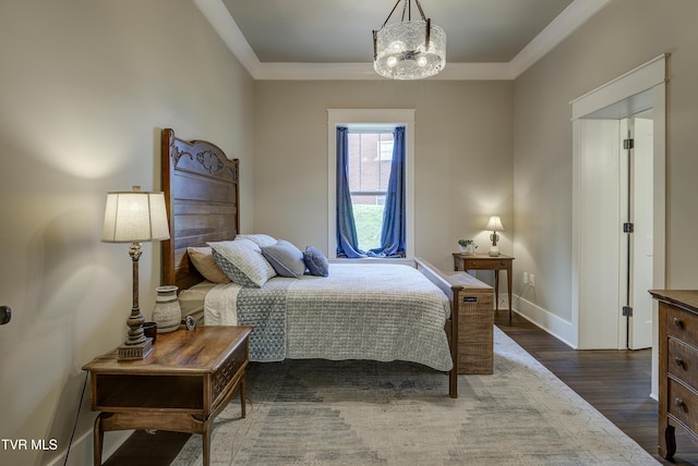 801 Watauga St, Kingsport, TN 37660 - bedroom featuring dark wood-type flooring, a chandelier, and ornamental molding