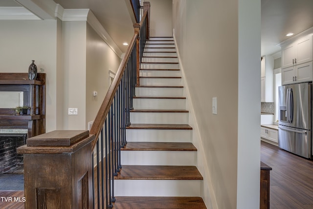 801 Watauga St, Kingsport, TN 37660 - stairs featuring wood finished floors, ornamental molding, and recessed lighting