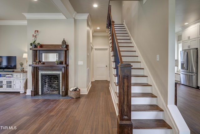 801 Watauga St, Kingsport, TN 37660 - staircase with crown molding, wood finished floors, recessed lighting, and a fireplace