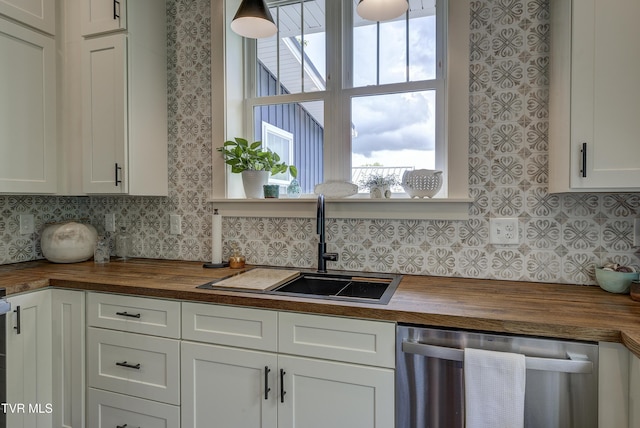 801 Watauga St, Kingsport, TN 37660 - kitchen with butcher block countertops, dishwasher, tasteful backsplash, and white cabinets