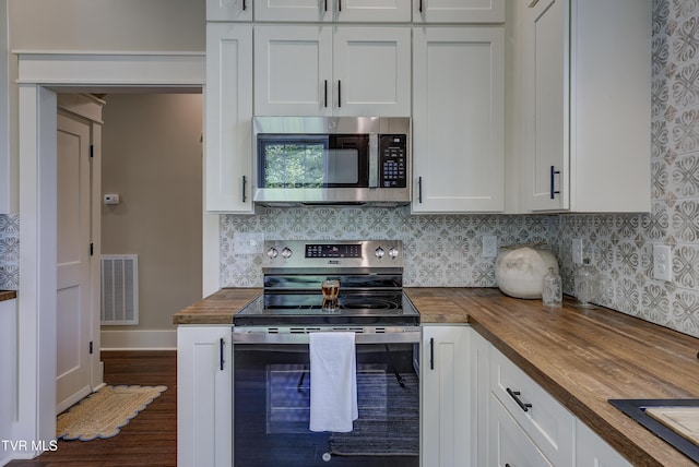 801 Watauga St, Kingsport, TN 37660 - kitchen with wooden counters, stainless steel appliances, backsplash, and white cabinetry