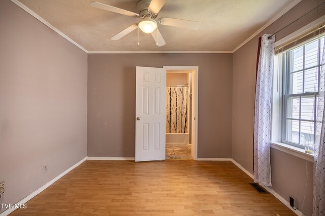 934 Massachusetts Ave, Bristol, VA 24201 - empty room featuring ceiling fan, light wood-style floors, and crown molding