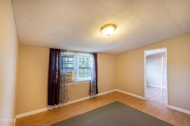 934 Massachusetts Ave, Bristol, VA 24201 - unfurnished room featuring a textured ceiling and wood finished floors