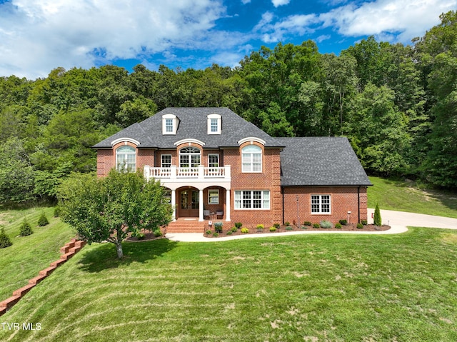 287 Pactolus Rd, Kingsport, TN 37663 - french country style house with brick siding, a balcony, a porch, and a front lawn
