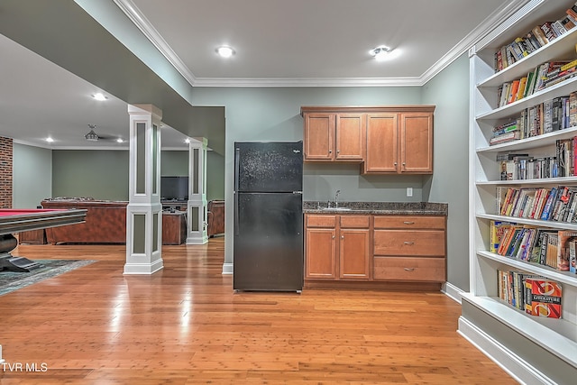287 Pactolus Rd, Kingsport, TN 37663 - kitchen featuring freestanding refrigerator, ornate columns, crown molding, light wood-type flooring, and brown cabinets