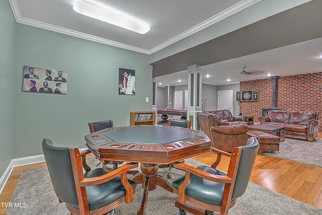 287 Pactolus Rd, Kingsport, TN 37663 - playroom with a wood stove, light wood-style floors, ornamental molding, and decorative columns