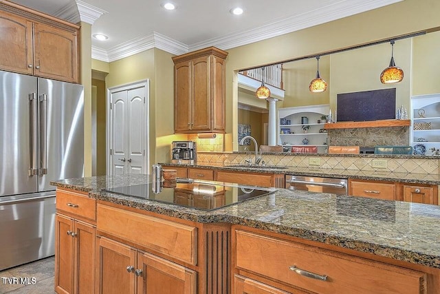 287 Pactolus Rd, Kingsport, TN 37663 - kitchen with stainless steel appliances, dark stone countertops, brown cabinetry, crown molding, and recessed lighting