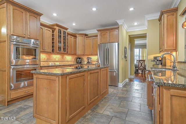 287 Pactolus Rd, Kingsport, TN 37663 - kitchen with stainless steel appliances, dark stone counters, crown molding, glass insert cabinets, and recessed lighting