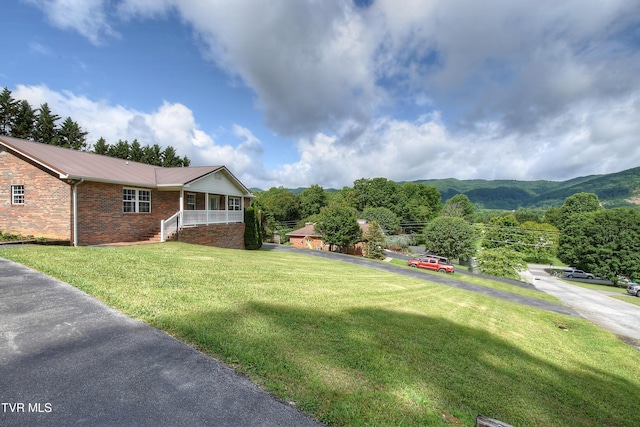 102 Spring Hill Dr, Unicoi, TN 37692 - view of green lawn featuring covered porch