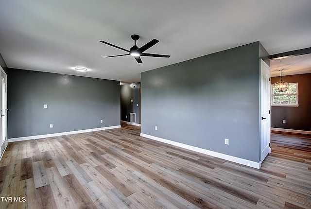 102 Spring Hill Dr, Unicoi, TN 37692 - unfurnished room featuring a chandelier, wood finished floors, and a ceiling fan
