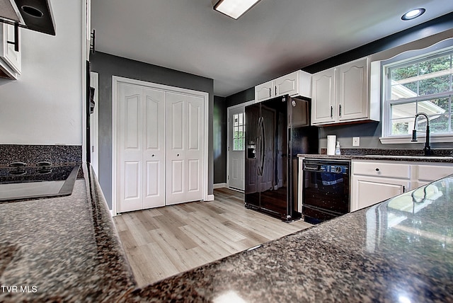 102 Spring Hill Dr, Unicoi, TN 37692 - kitchen with black appliances, white cabinetry, light wood finished floors, plenty of natural light, and recessed lighting