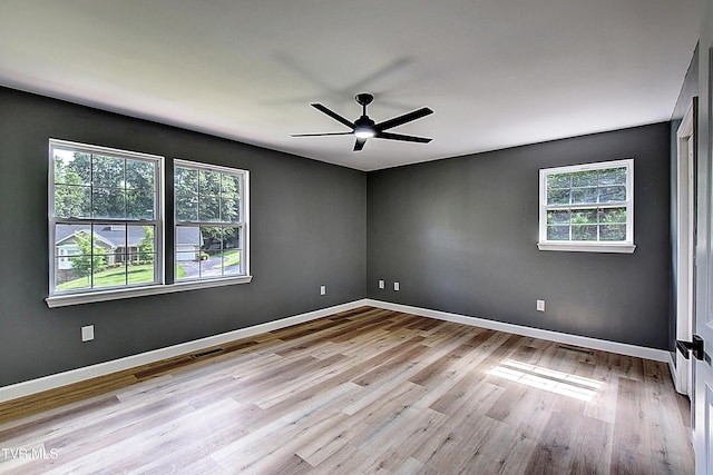 102 Spring Hill Dr, Unicoi, TN 37692 - spare room with healthy amount of natural light, wood finished floors, and a ceiling fan