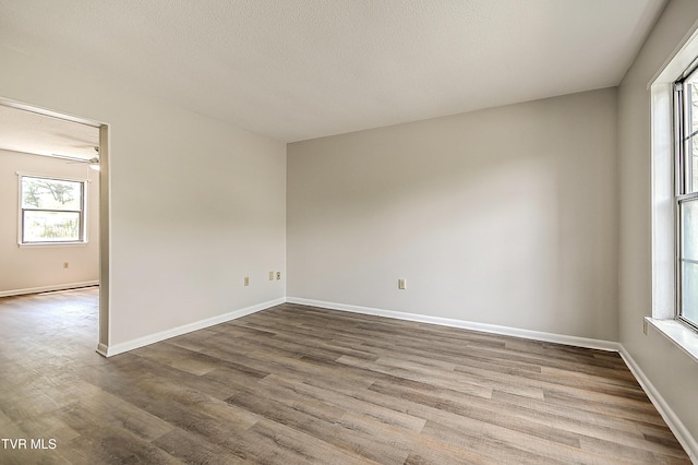 103 Northwinds Dr, Bristol, VA 24201 - spare room with wood finished floors, a ceiling fan, and a textured ceiling