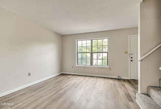 103 Northwinds Dr, Bristol, VA 24201 - foyer featuring stairs, wood finished floors, and a textured ceiling