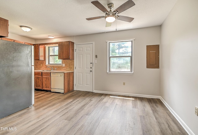 103 Northwinds Dr, Bristol, VA 24201 - kitchen with freestanding refrigerator, dishwasher, electric panel, light wood finished floors, and light countertops