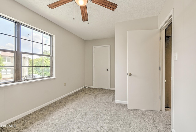 103 Northwinds Dr, Bristol, VA 24201 - unfurnished bedroom with light carpet, a textured ceiling, and a ceiling fan