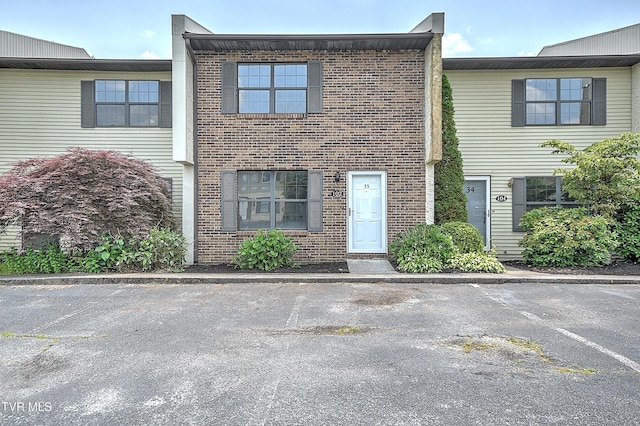 103 Northwinds Dr, Bristol, VA 24201 - view of property featuring brick siding and uncovered parking