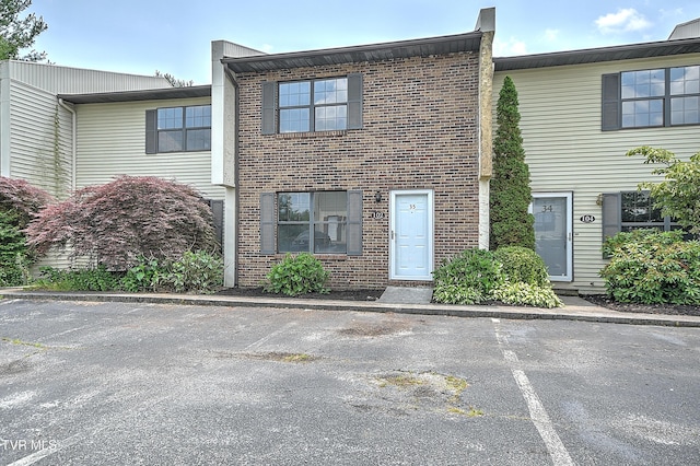 103 Northwinds Dr, Bristol, VA 24201 - townhome / multi-family property featuring brick siding and uncovered parking
