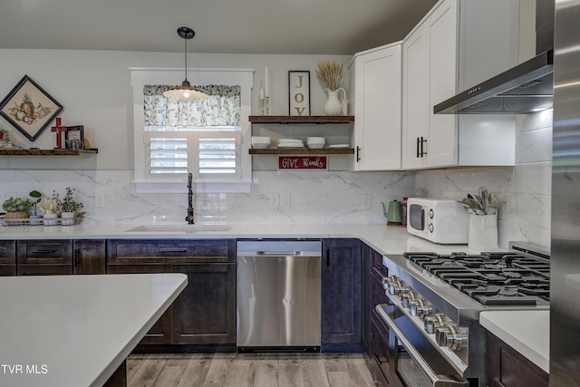 457 W St, Greeneville, TN 37745 - kitchen featuring appliances with stainless steel finishes, open shelves, wall chimney exhaust hood, and light countertops