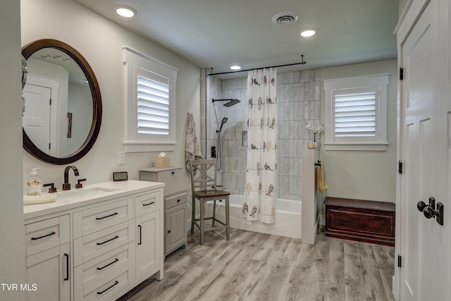 457 W St, Greeneville, TN 37745 - bathroom featuring plenty of natural light, vanity, shower / tub combo with curtain, wood finished floors, and recessed lighting