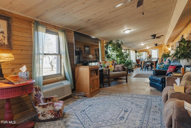 3521 James Phillips Way, Sevierville, TN 37876 - living room featuring ceiling fan, wood walls, light tile patterned floors, vaulted ceiling, and wood ceiling