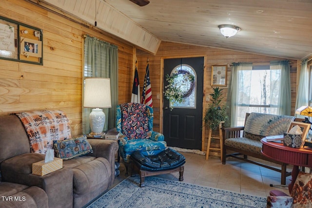 3521 James Phillips Way, Sevierville, TN 37876 - living room featuring vaulted ceiling, wooden walls, and tile patterned floors