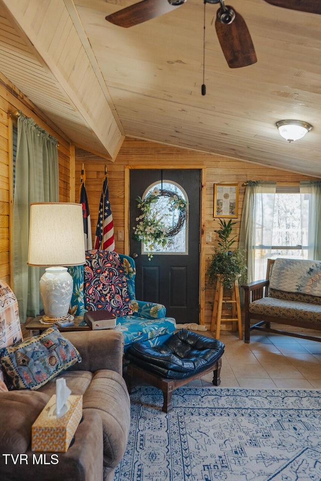 3521 James Phillips Way, Sevierville, TN 37876 - living room with wood walls, lofted ceiling, healthy amount of natural light, wood ceiling, and tile patterned floors