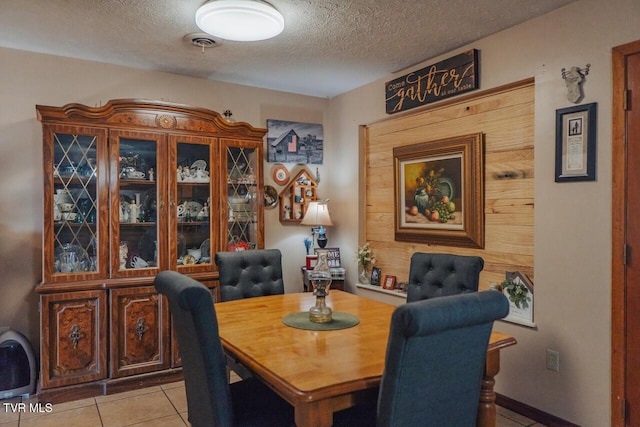 3521 James Phillips Way, Sevierville, TN 37876 - dining area with light tile patterned flooring and a textured ceiling