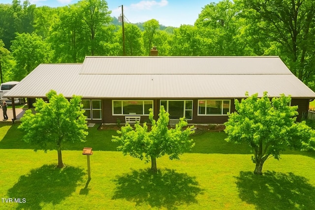 3521 James Phillips Way, Sevierville, TN 37876 - view of front facade featuring a front lawn and a chimney