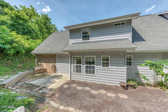 82 Hiddenbrook Ln Unit 82, Gray, TN 37615 - rear view of house featuring roof with shingles and a patio