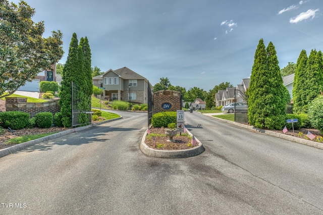 82 Hiddenbrook Ln Unit 82, Gray, TN 37615 - view of asphalt road with curbs, a residential view, and a gated entry